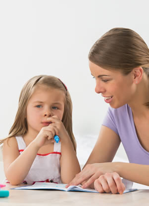 Tutor speaking with small girl